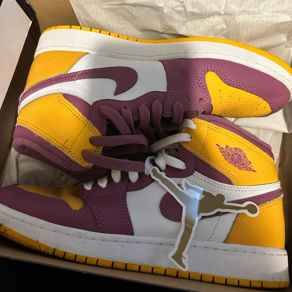 These are the university gold/white/light Bordeaux Jordan 1’s.